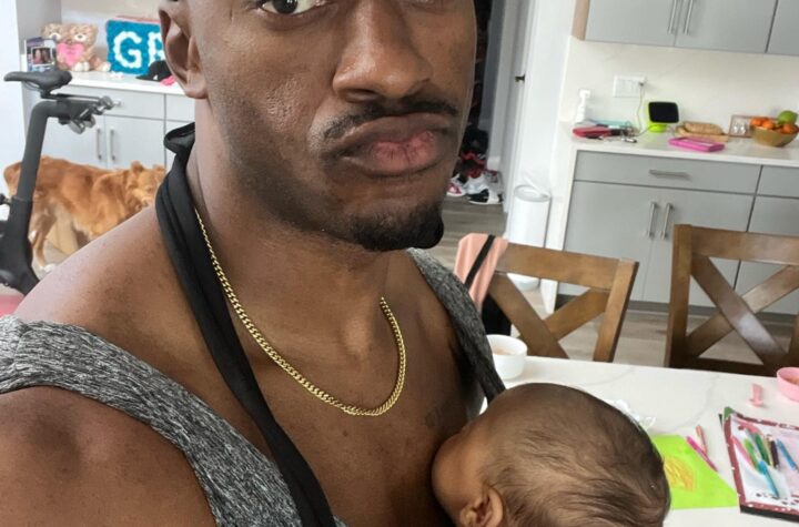 Robert Griffin III with a Baby Carrier